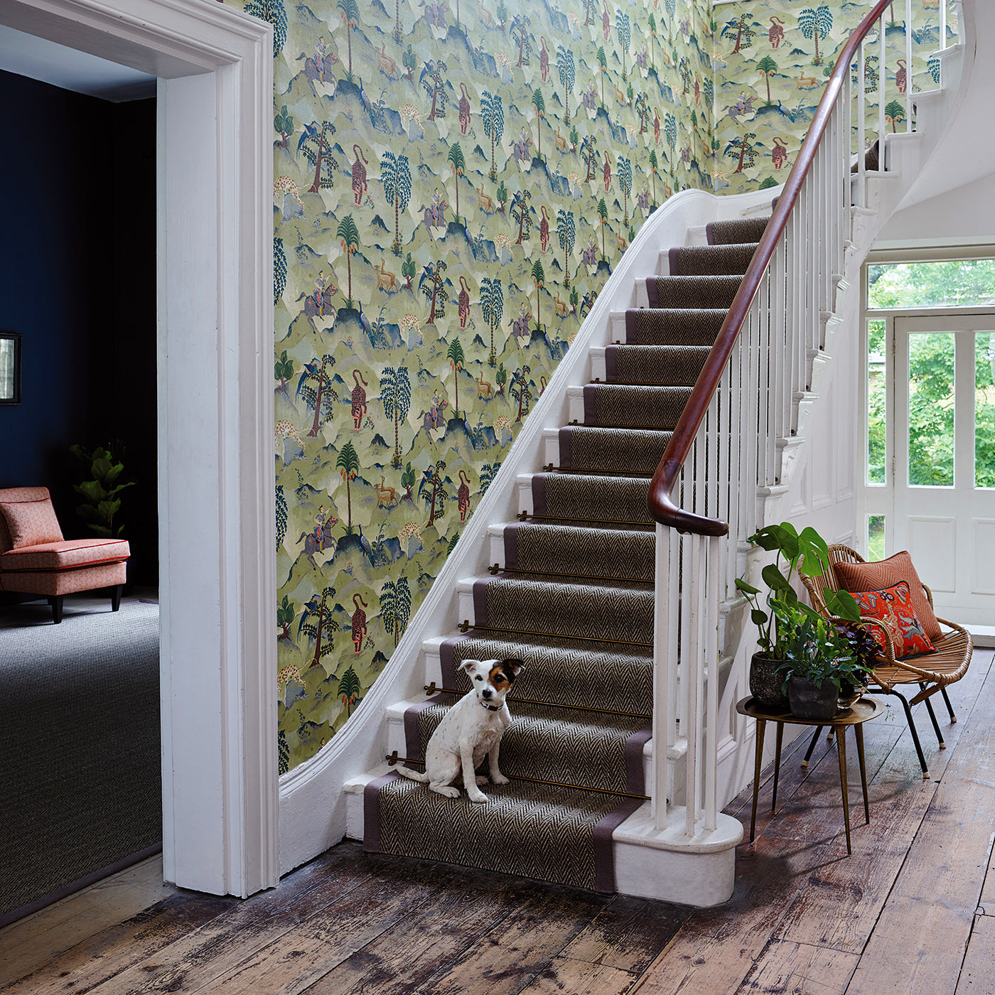 Staircase with a tropical wallpaper featuring a mystical scenic landscape.