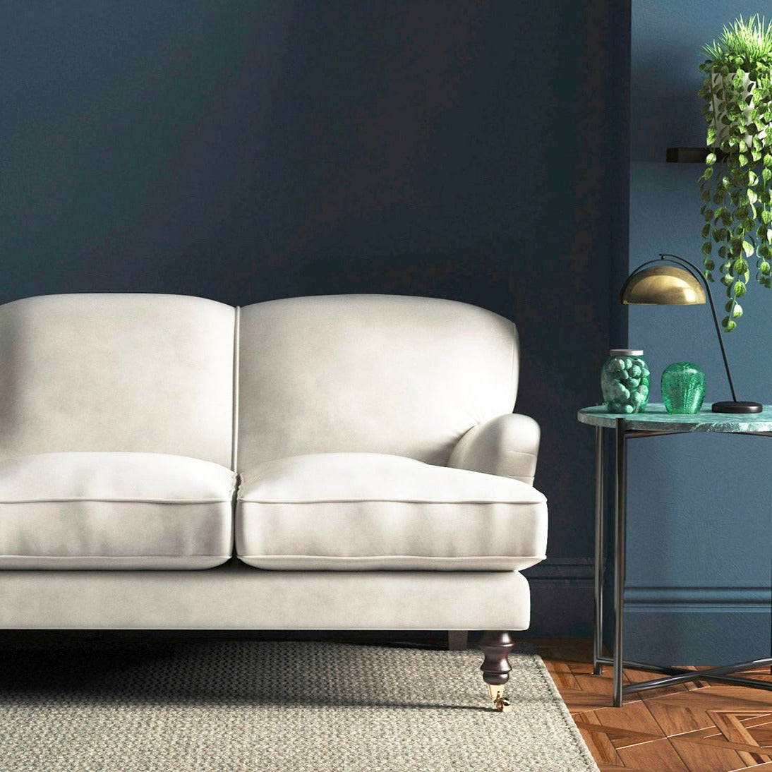 Sofa covered in a white velvet upholstery fabric