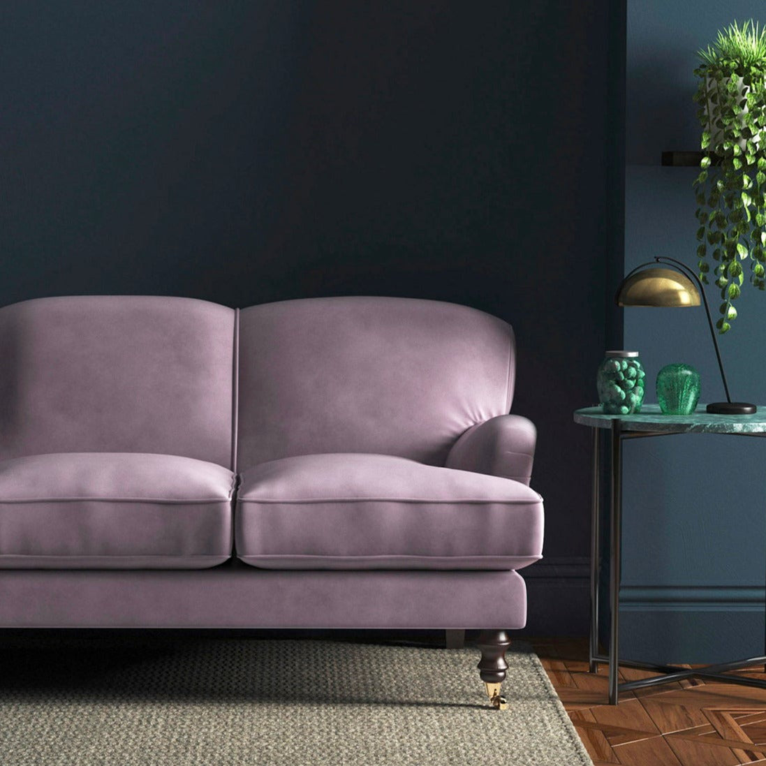 Sofa covered in a purple velvet upholstery fabric