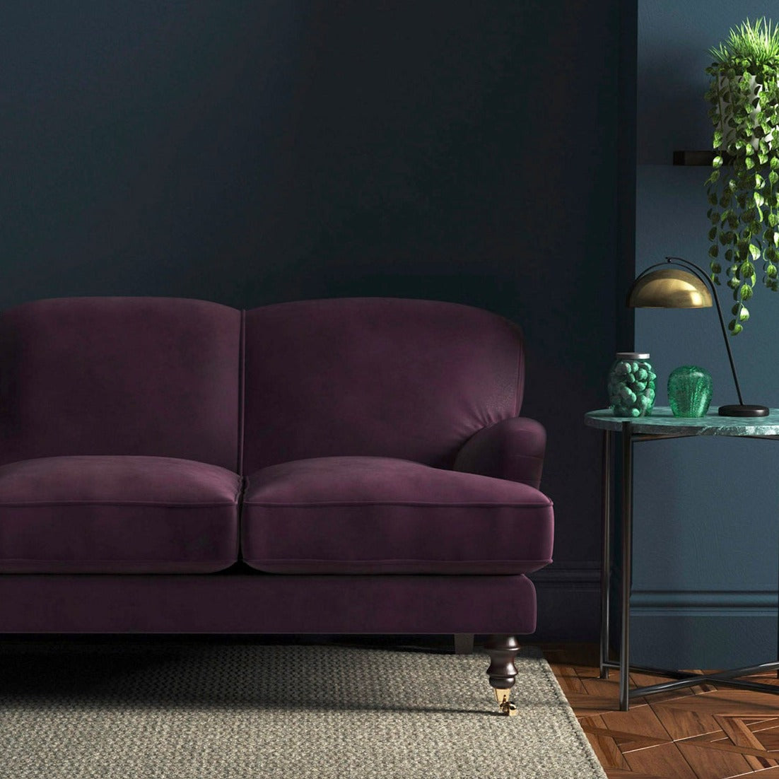 Sofa covered in a purple velvet upholstery fabric