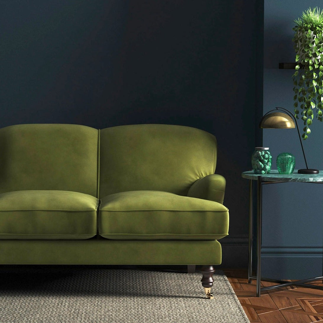 Sofa covered in a green velvet upholstery fabric