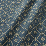 Linen fabric with a hand block-style pattern in blue, black and cream
