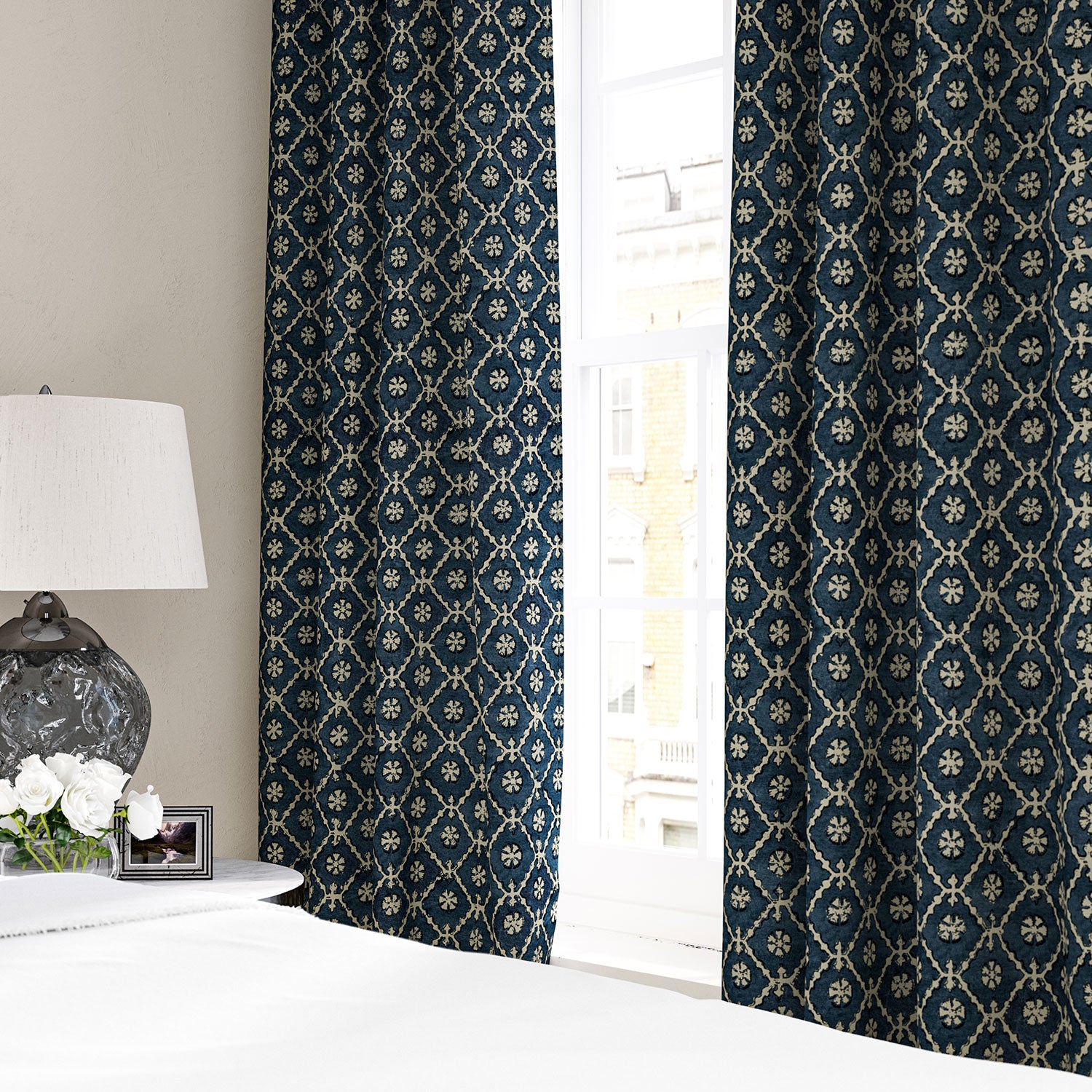 Linen curtain with a hand block-style pattern in blue, black and cream