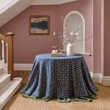 Tablecloth made from a linen fabric with a hand block-style pattern in blue, black and cream