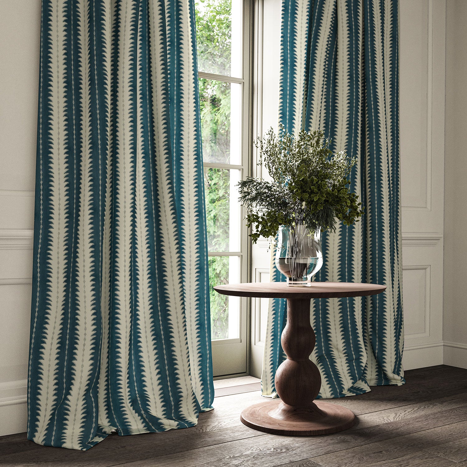Curtains made from a printed linen fabric in blue and off white, featuring a striped fern design.