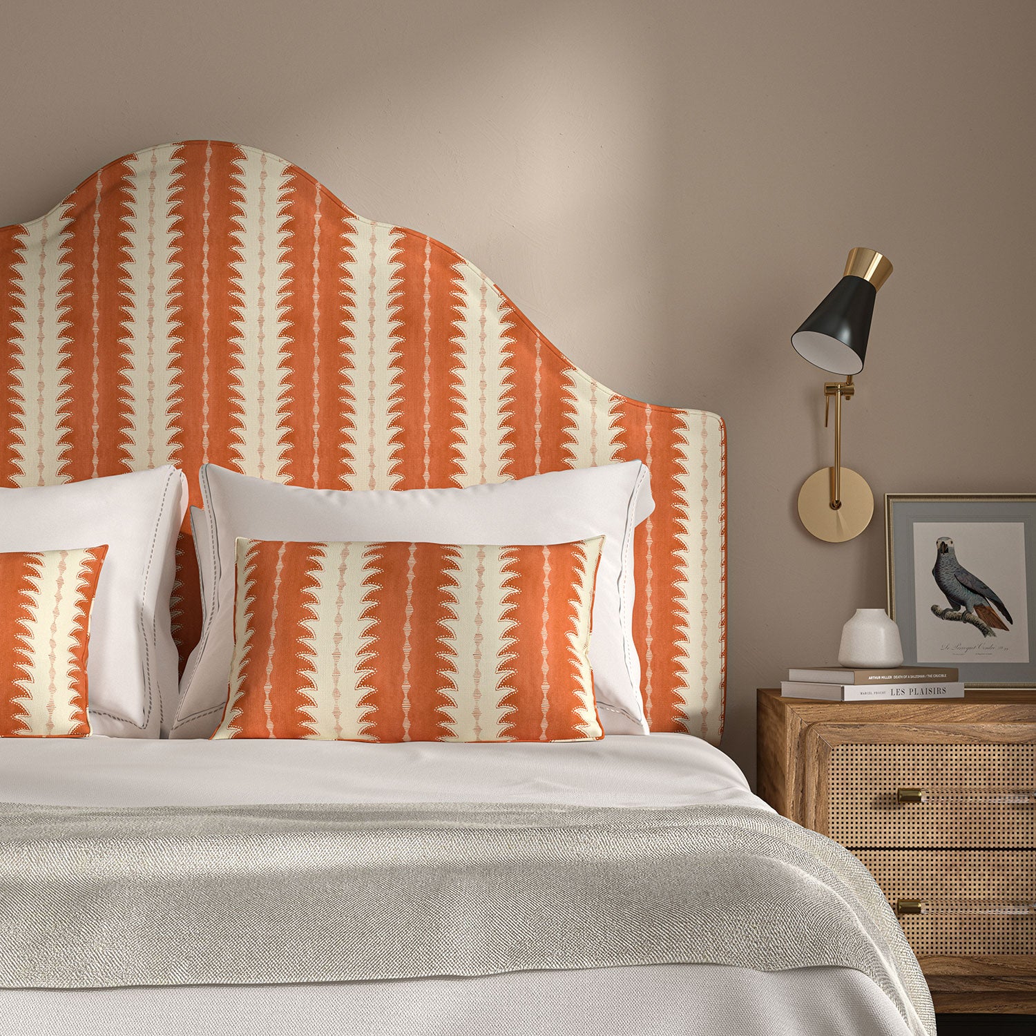 Headboard upholstered in a printed linen fabric in orange and off white, featuring a striped fern design.