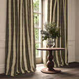 Curtain in a printed linen fabric in black and off white, featuring a striped fern design.