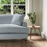 A blue stain resistant woven fabric on an armchair.