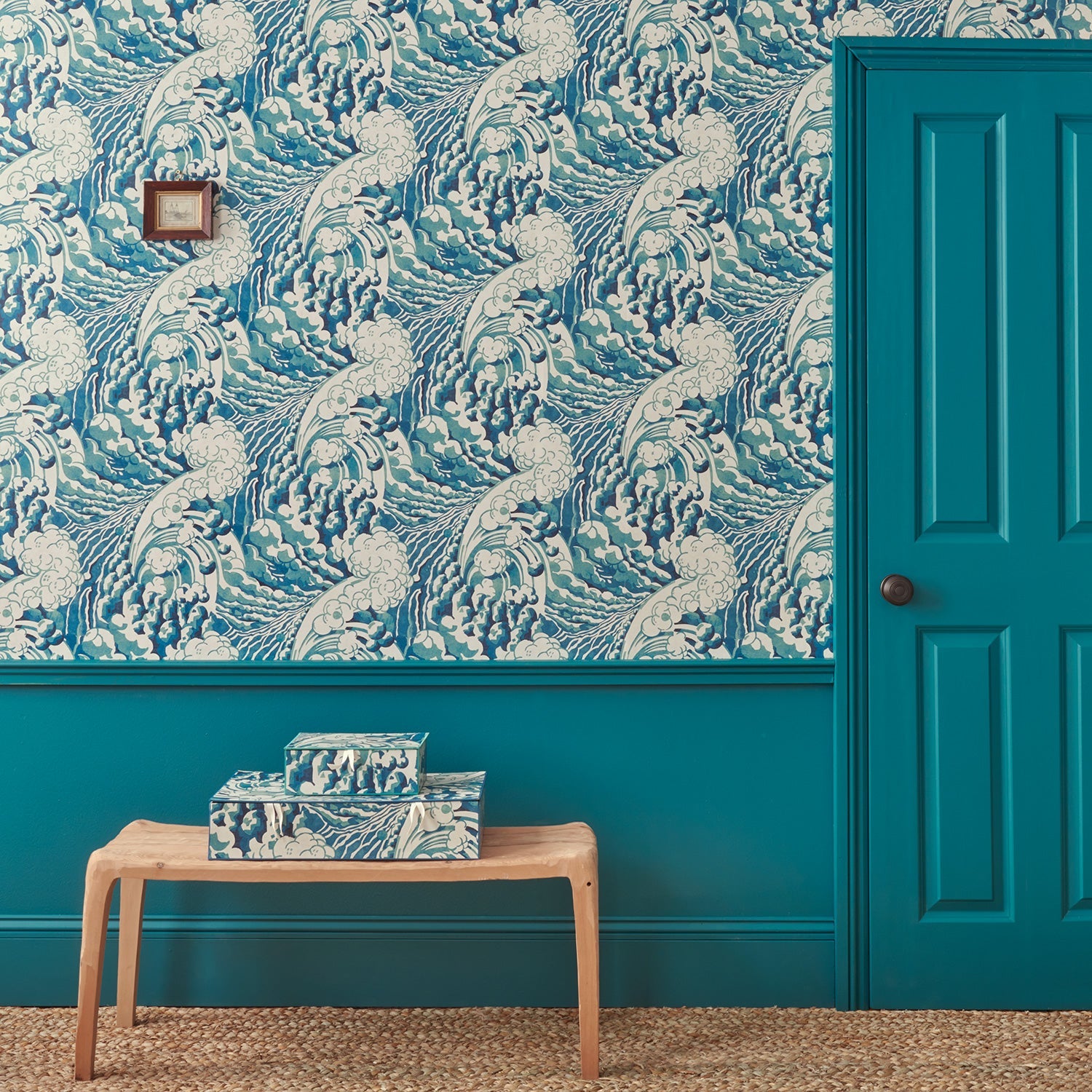 Sitting room with stylish abstract wallpaper featuring dramatic, undulating waves.
